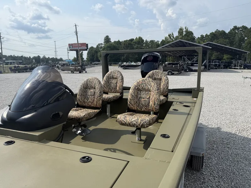 Slide: The Image of The image shows a 2027 Lowe Outlet 20-CATFISH boat with four cushioned seats. - 2