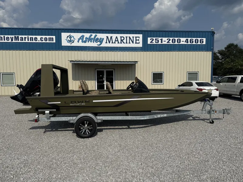 The Image of Lowe Outlet 20-CATFISH boat from 2027 on a trailer in front of a marine shop. - 1