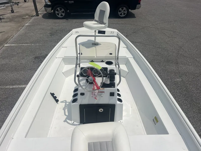 Slide: The Image of A 2026 G3 Bay 18 BAY-90 boat with a white deck and helm station. - 3