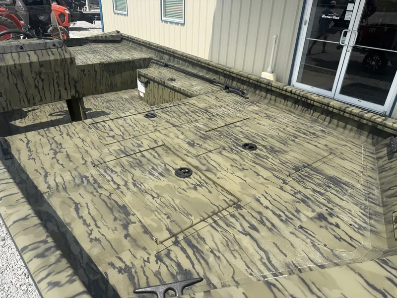 Slide: The Image of The image shows the deck of a Lowe Roughneck 1650SC boat with a camouflage pattern. - 6