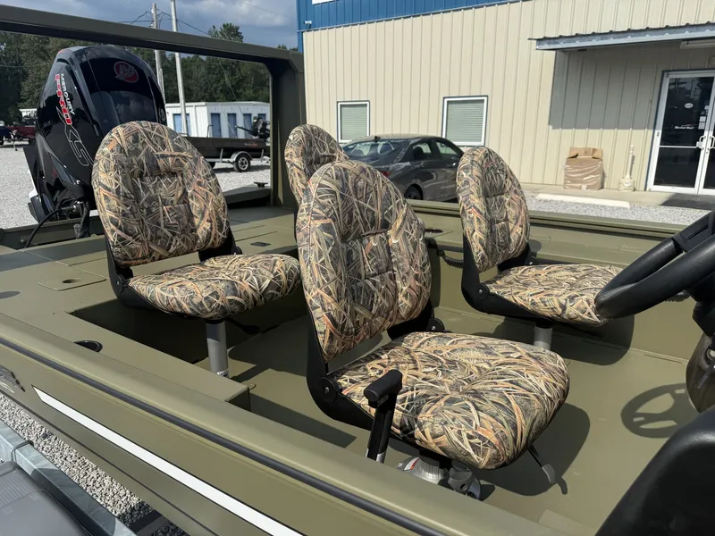 Slide: The Image of Four camo-patterned cushioned seats in an open boat. - 6