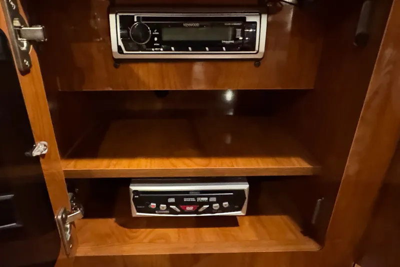 Slide: The Image of 2006 Four Winns 348 Vista interior with Kenwood stereo system in wooden cabinet. - 45