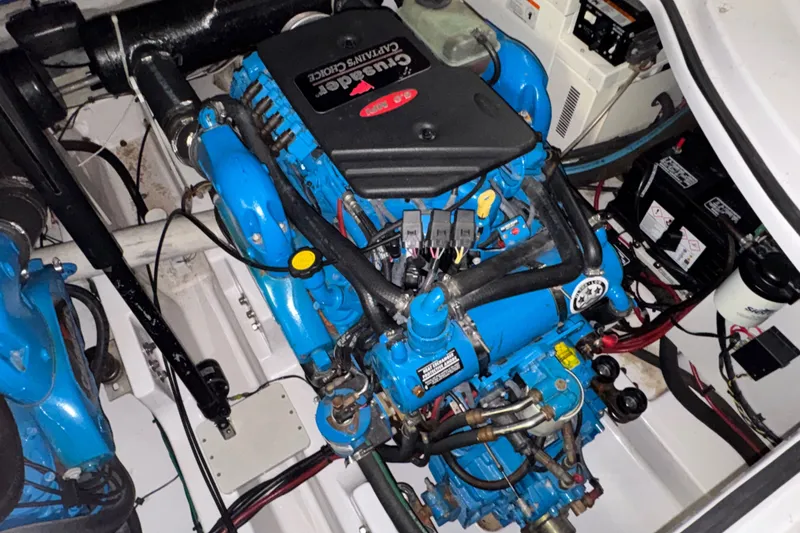Slide: The Image of Engine compartment of a 2006 Four Winns 348 Vista boat, featuring a Crusader engine. - 25