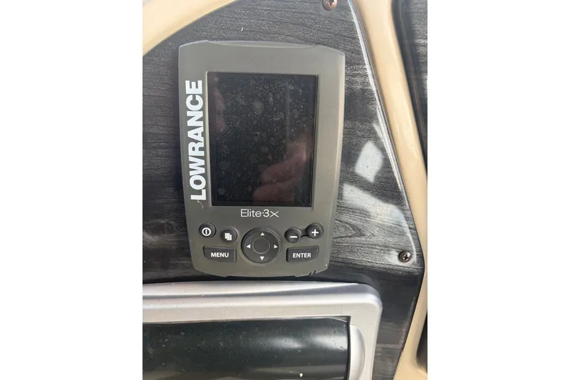 Slide: The Image of Lowrance Elite-3x fish finder on 2015 Sweetwater 2286 boat dashboard. - 16