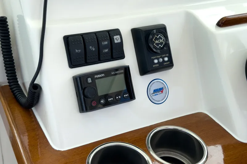 Slide: The Image of Control panel of 2020 Hunt Yachts Surfhunter 32 with switches and Fusion audio system. - 41