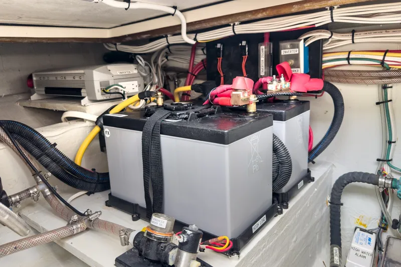 Slide: The Image of Battery compartment of 2020 Hunt Yachts Surfhunter 32, featuring wiring and inverter. - 66