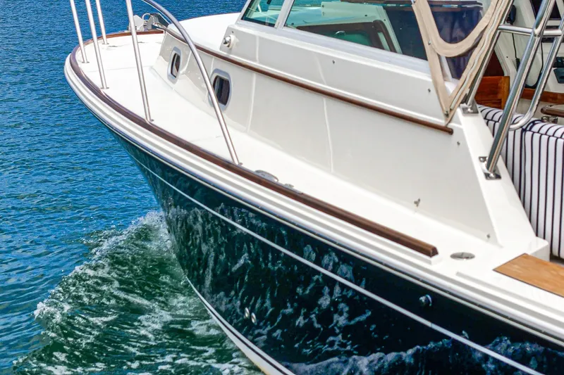 Slide: The Image of 2020 Hunt Yachts Surfhunter 32 cruising on blue water, showcasing sleek design and craftsmanship. - 67