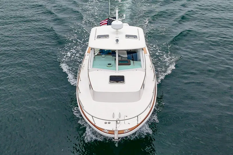 Slide: The Image of 2020 Hunt Yachts Surfhunter 32 cruising on open water, aerial view. - 16