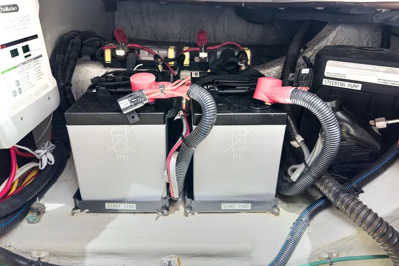 Slide: The Image of Battery compartment of a 2020 Hunt Yachts Surfhunter 32, featuring dual marine batteries. - 65