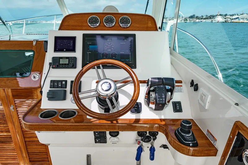 Slide: The Image of Helm of 2020 Hunt Yachts Surfhunter 32 with modern navigation controls. - 36