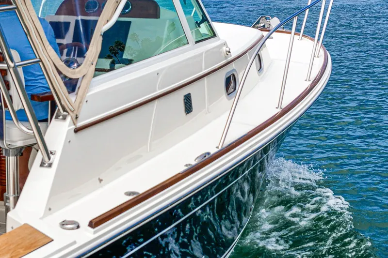 Slide: The Image of 2020 Hunt Yachts Surfhunter 32 cruising on clear blue water. - 68