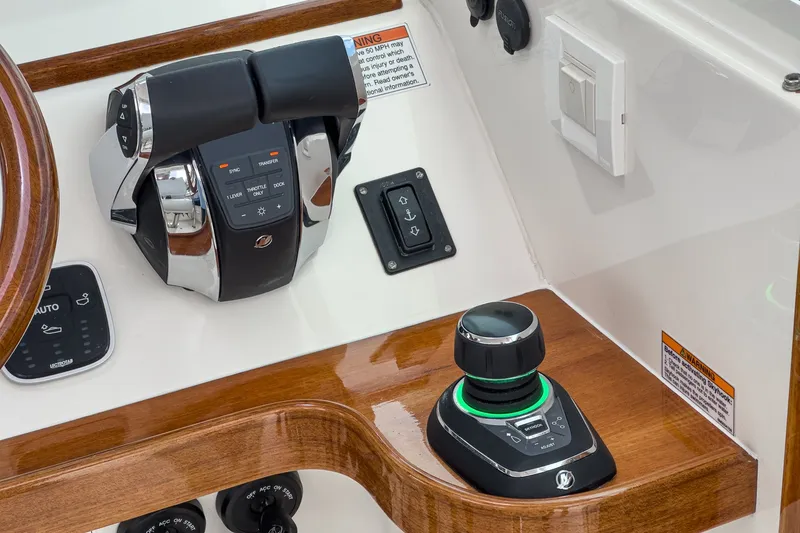 Slide: The Image of Control panel of 2020 Hunt Yachts Surfhunter 32 with joystick and throttle controls. - 39