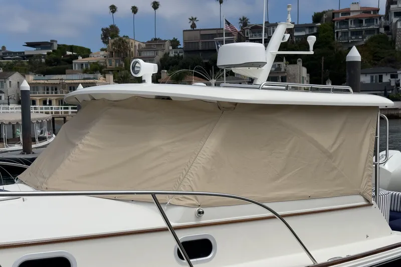 Slide: The Image of 2020 Hunt Yachts Surfhunter 32 docked with beige canopy cover. - 62