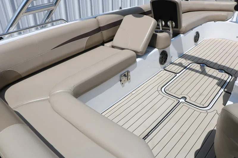 Slide: The Image of 2022 Hurricane SunDeck Sport 201 IO boat interior with beige seating and sleek flooring. - 24