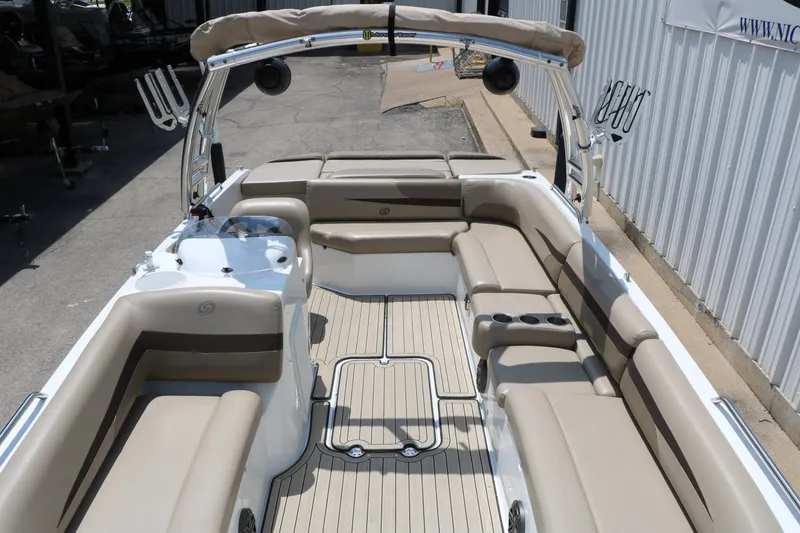 Slide: The Image of 2022 Hurricane SunDeck Sport 201 IO boat interior with beige seating and spacious layout. - 20