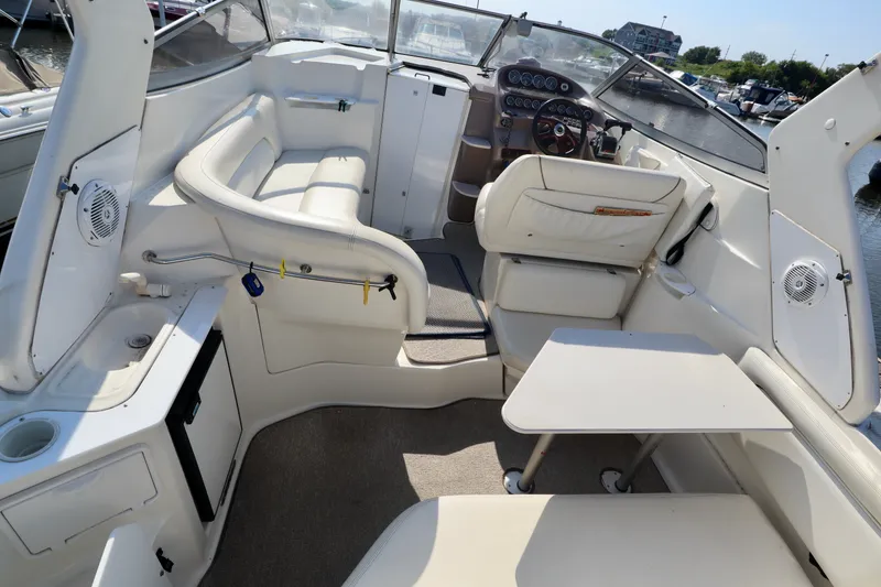 Slide: The Image of The image shows the cockpit of a 2003 Regal Commodore 2860 with beige seating and a helm station. - 5