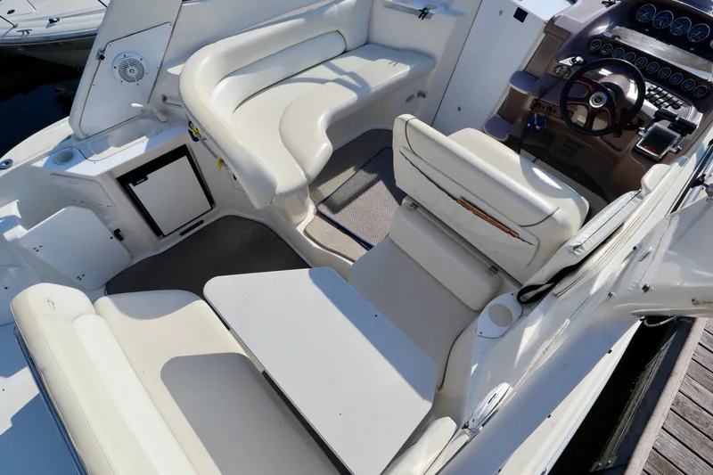Slide: The Image of The image shows the cockpit of a 2003 Regal Commodore 2860 with white cushioned seating and a helm. - 10