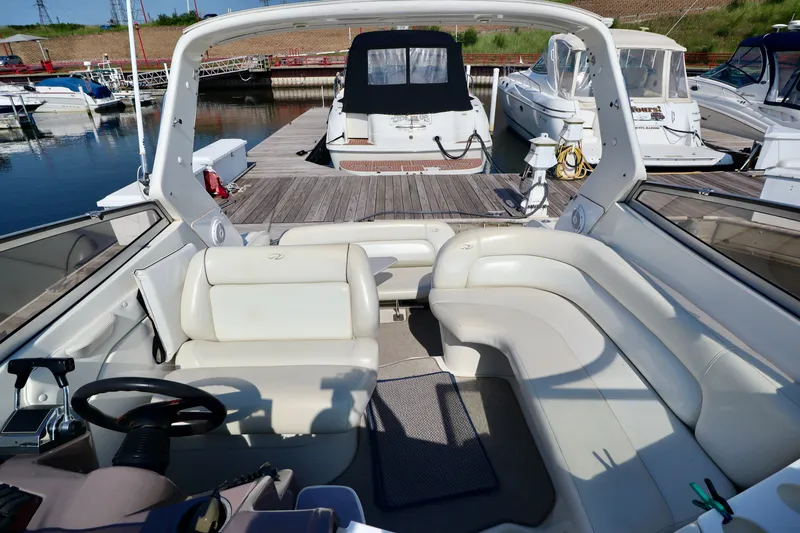 Slide: The Image of The image shows the cockpit of a 2003 Regal Commodore 2860 with white leather seating. - 8