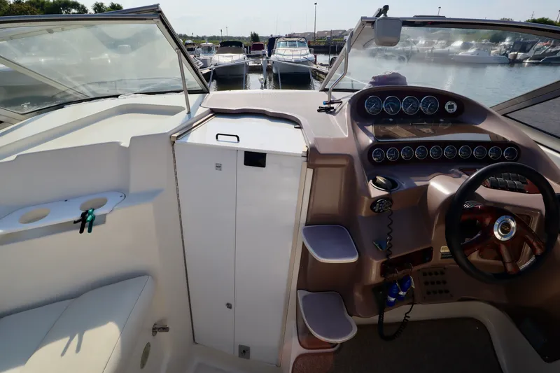 Slide: The Image of The cockpit of a 2003 Regal Commodore 2860 with helm and instruments. - 9