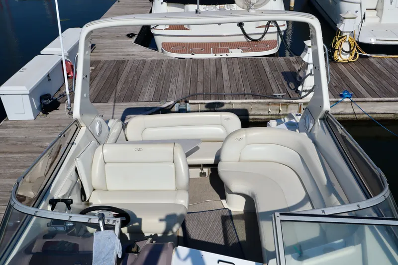 Slide: The Image of The image shows the cockpit of a 2003 Regal Commodore 2860 with white leather seating. - 2
