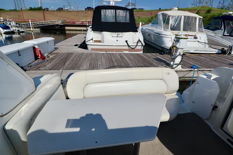 Slide: The Image of The image shows the cockpit of a 2003 Regal Commodore 2860 with white cushioned seating and a table. - 6