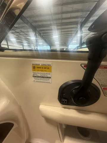 Slide: The Image of Interior view of a 2001 Sea Ray 260 Signature with a capacity label for 10 people. - 8