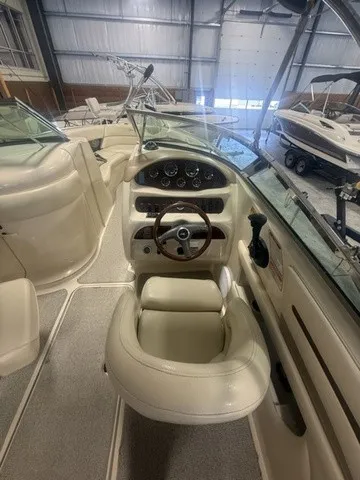 Slide: The Image of The image shows the cockpit of a 2001 Sea Ray 260 Signature with a sleek steering wheel. - 7