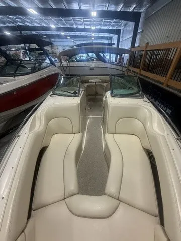 Slide: The Image of Interior view of a Sea Ray 260 Signature boat with beige seating in a warehouse. - 20