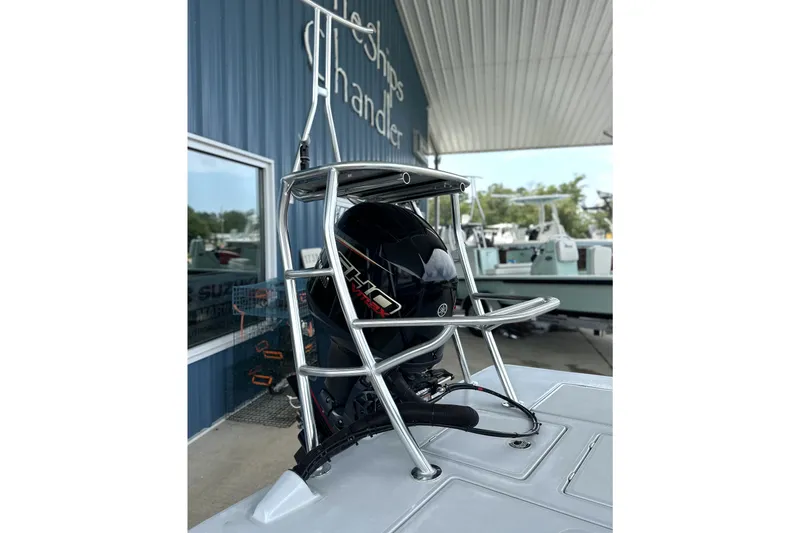 Slide: The Image of 2027 Maverick 18 HPX-V boat with Yamaha outboard motor and sturdy metal frame. - 10