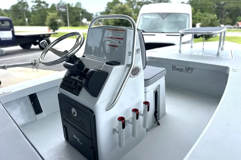 Slide: The Image of 2027 Maverick 18 HPX-V boat interior with steering console and rod holders. - 8