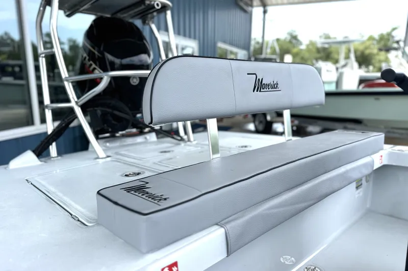 Slide: The Image of 2027 Maverick 18 HPX-V boat interior with cushioned seating and sleek design. - 11