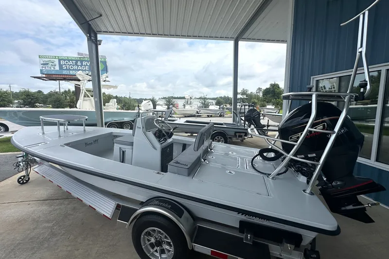Slide: The Image of 2027 Maverick 18 HPX-V boat on trailer, displayed at dealership under canopy. - 3