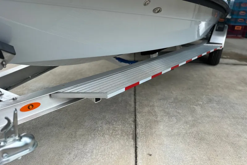 Slide: The Image of Trailer for 2027 Maverick 18 HPX-V boat, featuring reflective safety markers. - 5