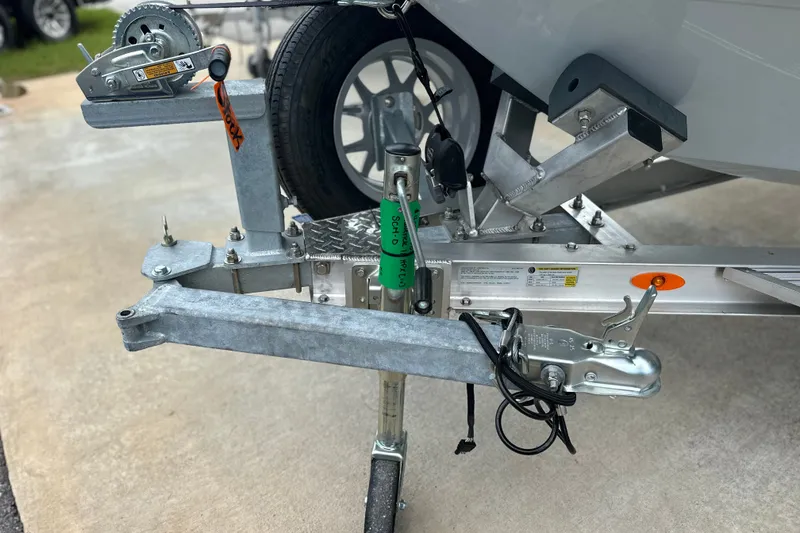 Slide: The Image of Trailer hitch and winch of 2027 Maverick 18 HPX-V boat on concrete surface. - 6
