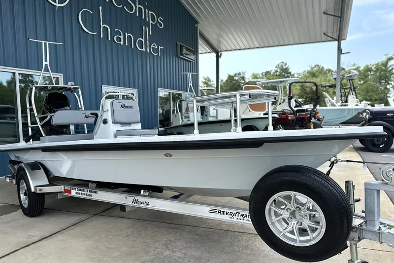 Slide: The Image of 2027 Maverick 18 HPX-V boat on trailer at dealership, showcasing sleek design. - 13