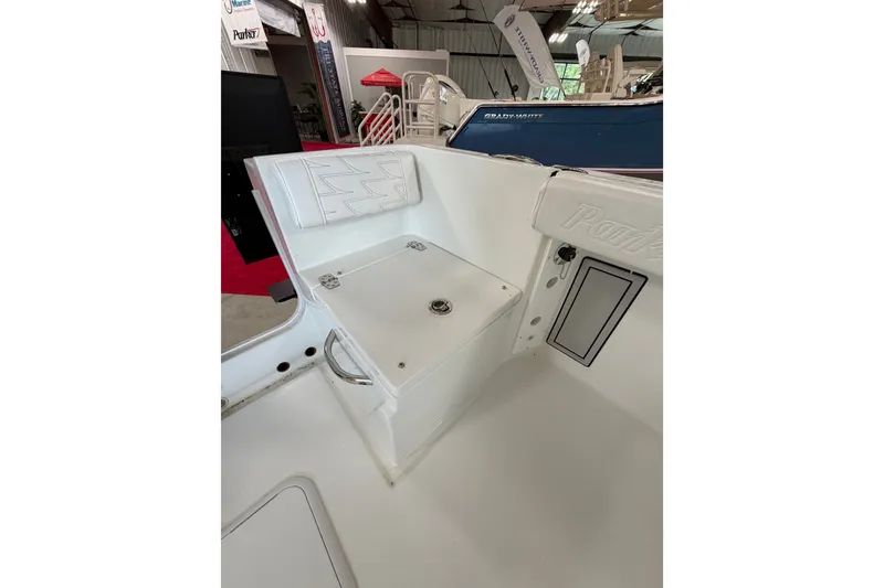 Slide: The Image of Interior view of a 2027 Parker 230 Coastal Elite boat, showcasing seating and storage. - 9