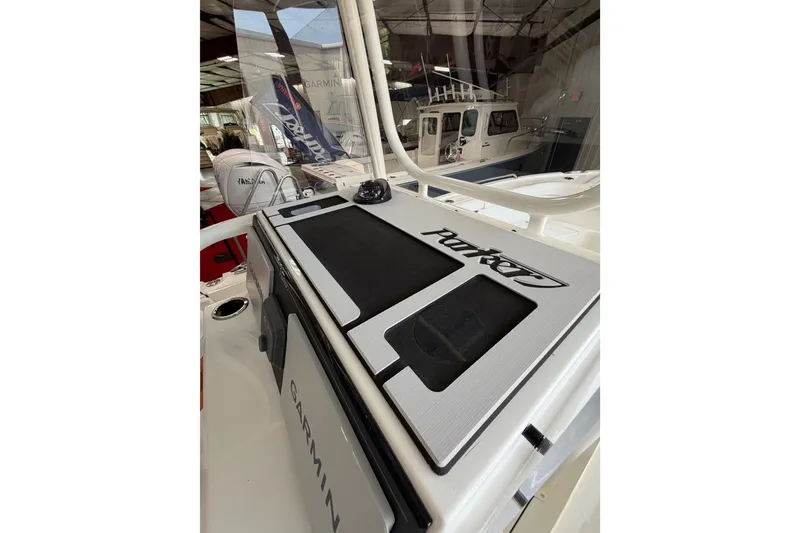 Slide: The Image of 2027 Parker 230 Coastal Elite boat dashboard with Garmin equipment in showroom. - 12