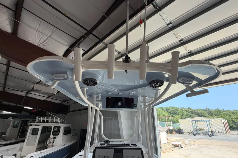 Slide: The Image of 2027 Parker 230 Coastal Elite boat in a storage facility, showcasing its advanced features. - 10