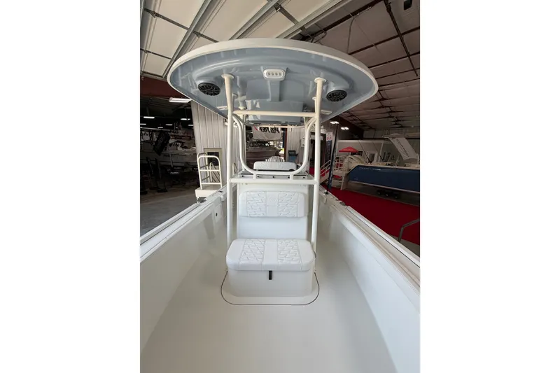Slide: The Image of Interior view of 2027 Parker 230 Coastal Elite boat, showcasing seating and helm area. - 19