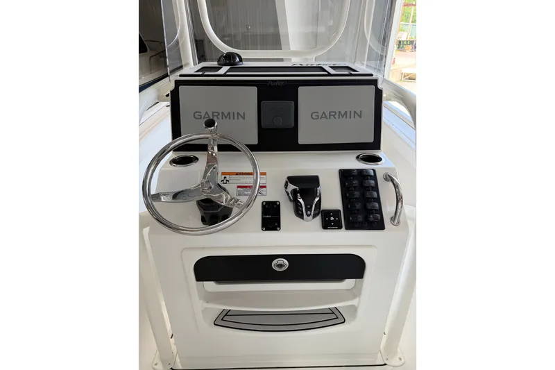 Slide: The Image of Helm of 2027 Parker 230 Coastal Elite boat with Garmin navigation system. - 11