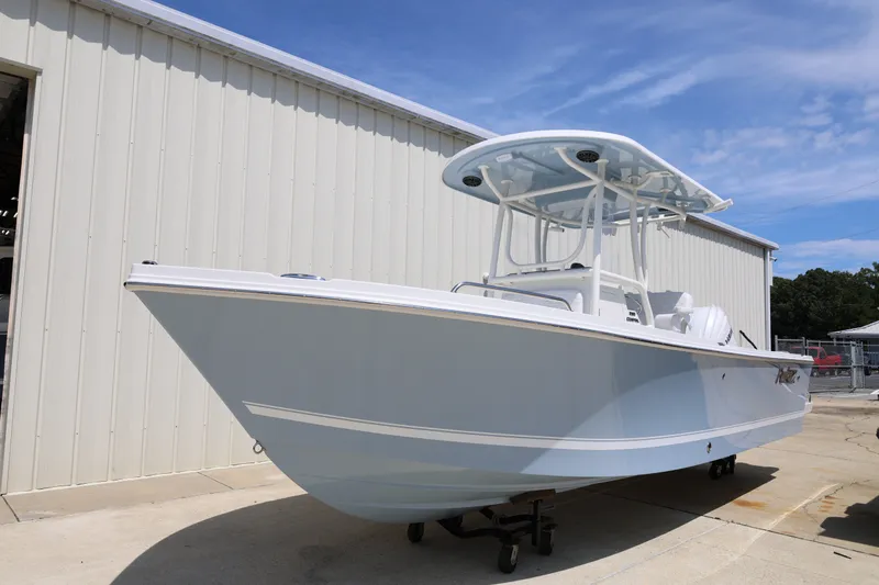 Slide: The Image of 2027 Parker 230 Coastal Elite boat displayed outdoors, showcasing sleek design and modern features. - 5