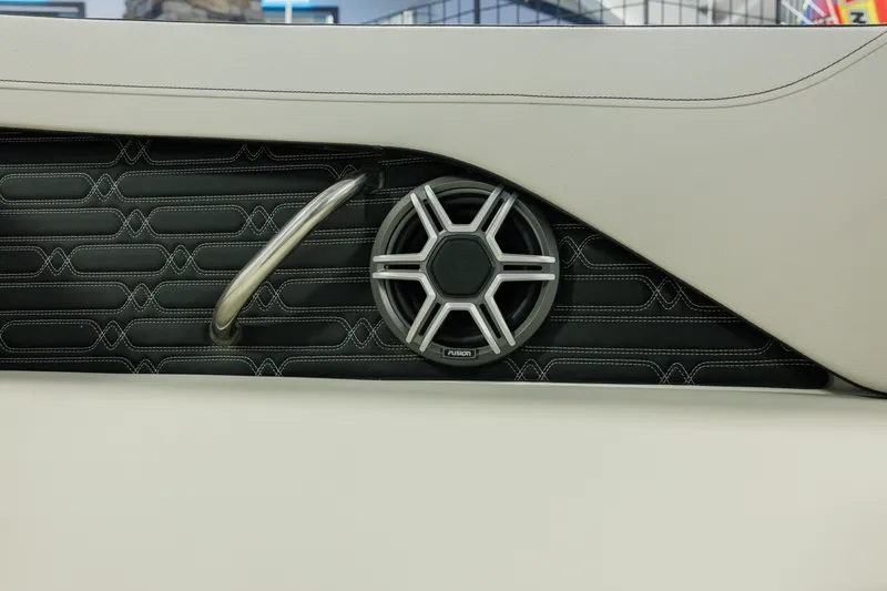 Slide: The Image of 2027 Sea Ray SPX 210 interior speaker detail with stylish stitching and metal handle. - 15