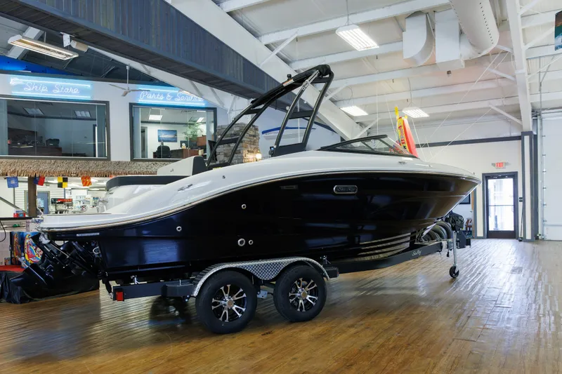 Slide: The Image of 2027 Sea Ray SPX 210 boat displayed indoors on a trailer. - 4