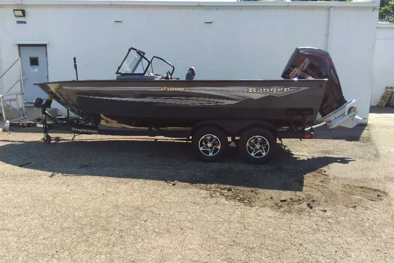 The Image of 2026 Ranger VX1988 WT boat on trailer, parked outdoors, side view. - 0