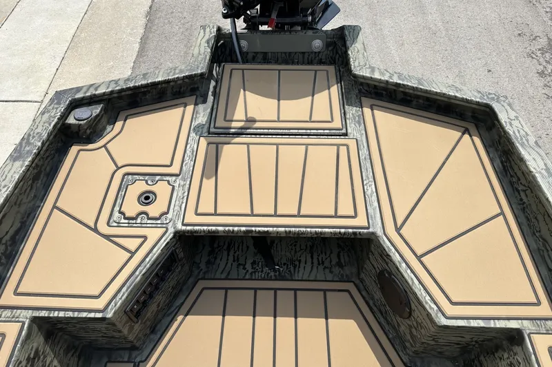 Slide: The Image of 2026 Tracker Grizzly 1650 T Prairie Wings Edition boat interior with camouflage design. - 14
