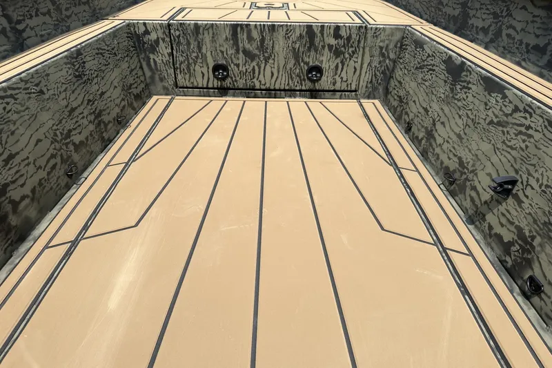 Slide: The Image of 2026 Tracker Grizzly 1650 T Prairie Wings Edition boat interior with camouflage design. - 19