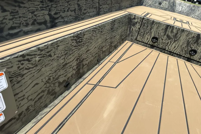 Slide: The Image of Interior view of 2026 Tracker Grizzly 1650 T Prairie Wings Edition boat with camo design. - 17