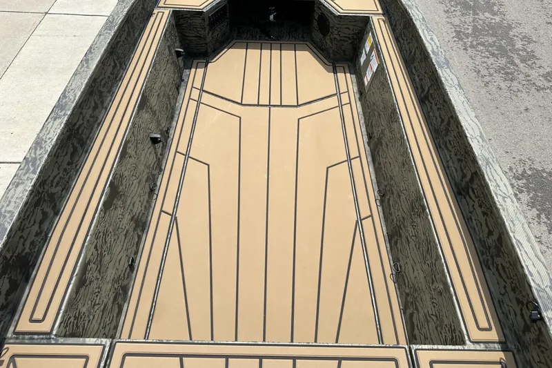 Slide: The Image of 2026 Tracker Grizzly 1650 T Prairie Wings Edition boat interior with camouflage design. - 13