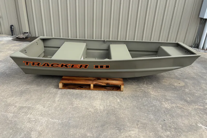 The Image of 2026 Tracker Grizzly 10 Jon boat on wooden pallet, displayed outdoors. - 1