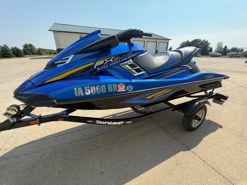 Slide: The Image of A blue 2016 Yamaha WaveRunner FX Cruiser SVHO on a trailer in a concrete lot. - 2